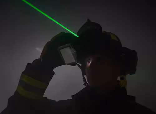 A firefighter at Eglin Air Force Base deploying the laser on his C-THRU Navigator